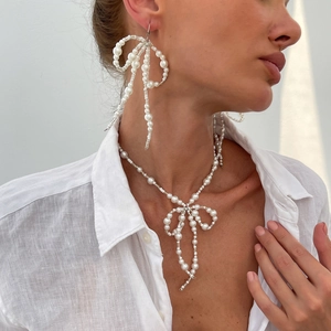 Minimalist pearl jewelry set with bow necklace and matching tassel earrings for women