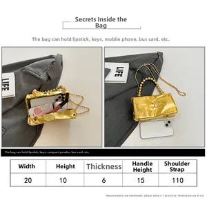Size guide for gold quilted clutch featuring pearl handle and chain strap measurements