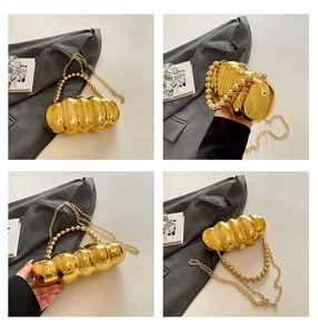 Detailed four-way views of a golden textured acrylic evening clutch with beaded handle
