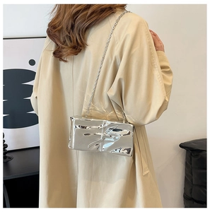 Silver metallic shoulder bag with lava mirror texture and elegant silver chain strap