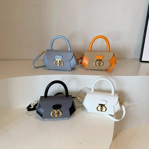 Modern minimalist mini crossbody handbags in assorted colors displayed on white stairs