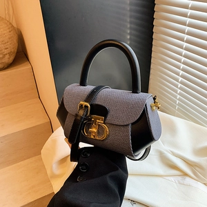 Vintage style black leather and tweed patchwork handbag with gold CD metal buckle
