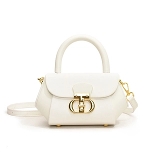 Minimalist white leather crossbody bag with round handle and gold buckle detail