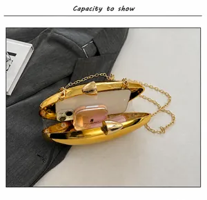 Internal view of gold evening clutch bag showing capacity for phone and lipstick