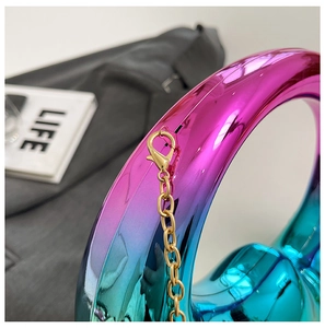 Macro shot of gradient metallic moon bag with premium gold chain and lobster clasp hardware