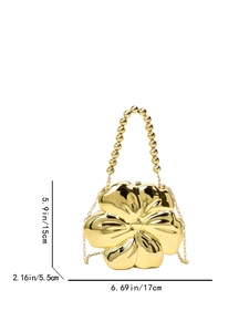 Detailed size view of the golden flower-shaped clutch bag with pearl bead handle