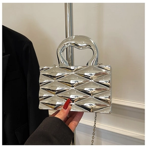 Detail of silver box bag featuring 3D geometric diamond texture and metallic finish
