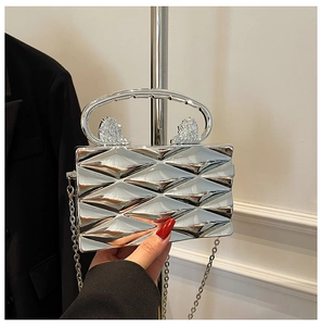 Metallic silver clutch bag with diamond texture and double lion head details