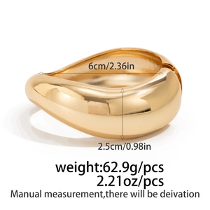 Polished gold teardrop bangle details showing inner diameter 6cm and width 2.5cm