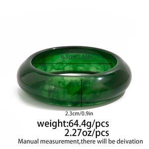Detail view of dark green resin bangle showing dimensions and translucent texture