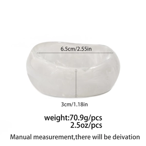 Detail view of resin bangle with dimension specs: 6.5cm inner diameter and 3cm width
