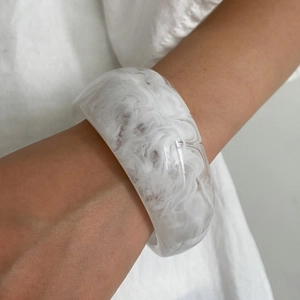 Fashionable chunky clear resin bangle featuring white marble texture for women