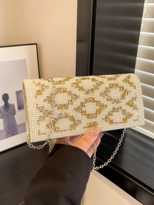 Elegant ivory faux pearl evening clutch bag with sparkling rhinestone rings and silver chain