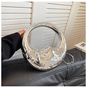 Silver crescent moon evening bag with polished mirror finish and elegant metal chain strap