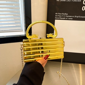 Elegant gold evening clutch bag with double dragon handles and metallic stripe texture