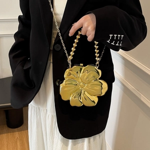 Elegant gold flower-shaped evening box bag with metallic texture and beaded handle