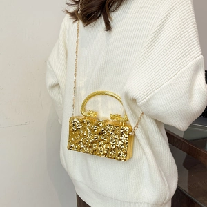 Chic gold metallic acrylic box bag with unique dragon handle and chain shoulder strap