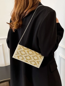 Elegant beaded pearl clutch bag with gold ring pattern and silver chain strap for women