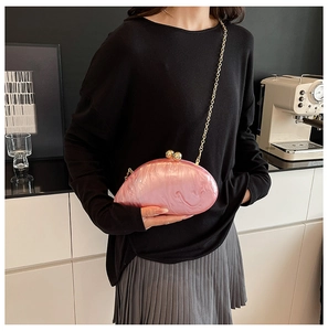 Pink marble texture acrylic evening clutch with gold beads clasp and chain strap detail