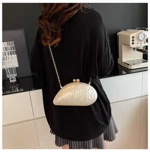 Chic pearl-textured shell acrylic clutch bag with gold chain strap for evening events