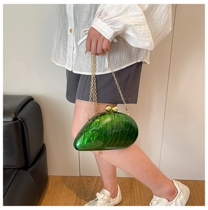 Green marble acrylic slug shaped clutch with gold spherical clasp and chain strap