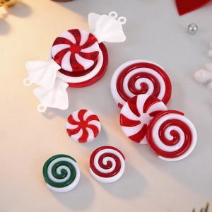 Detail view of assorted red, green and white peppermint candy resin Christmas ornaments