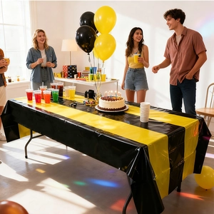 Rectangular black and gold striped disposable tablecloth for festive birthday party decor