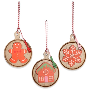 Detail showing wooden Christmas ornaments with gingerbread man and snowflake patterns