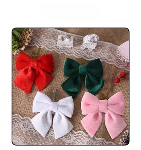 Velvet Christmas bows in red, green, white, and pink for festive tree and gift decoration