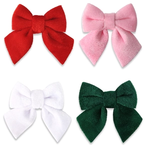 Set of four velvet Christmas bows in red pink white and green for festive tree decoration