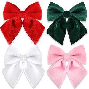 Velvet bow hair clips set in red, green, white, and pink with a soft plush texture