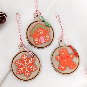 Detail of wooden Christmas ornaments featuring gingerbread man and snowflake designs