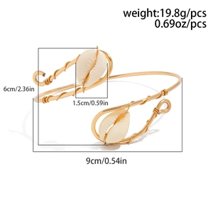 Detail view of gold wire wrapped arm cuff with shell accents and weight 19.8g specifications