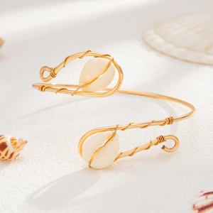 Golden wire wrapped open arm cuff bracelet with natural seashells for women's vacation