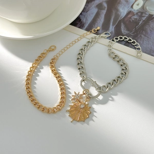 Hip hop style chunky link bracelets with starburst pendant and gold-tone metal finish