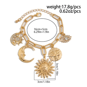 Detailed view of gold multi-pendant bracelet with celestial sun and moon charms