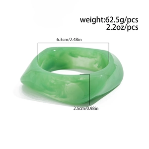 Macro detail of green marble resin bracelet with square silhouette and smooth texture
