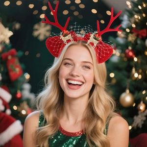 Detail view of cute red Christmas reindeer antler headband with festive golden accents