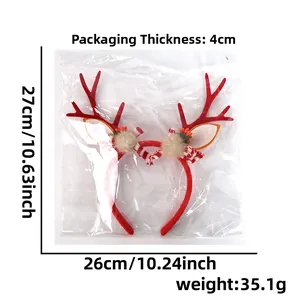 Detailed view of red Christmas reindeer headband with plush balls and striped bow decoration