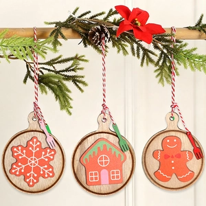 Wooden Christmas cookie ornaments set with snowflake, gingerbread house and red twine