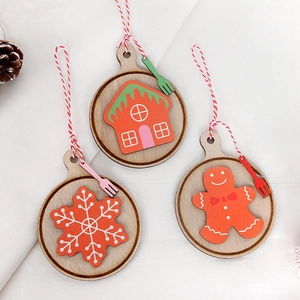 Three-piece set of wooden Christmas ornaments featuring gingerbread man and snowflake