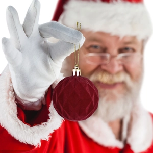 Set of burgundy velvet Christmas balls with geometric facets and golden string hangers
