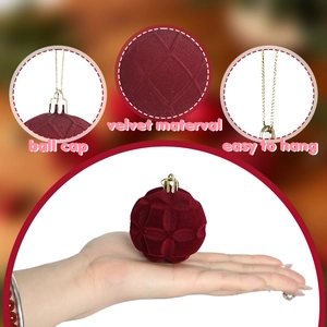 Set of dark red velvet Christmas balls with geometric patterns and hanging chains