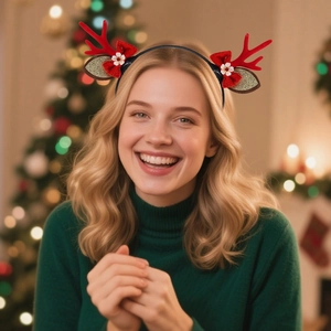 Christmas reindeer antler headband with red bows and floral accents on a model