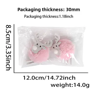 Detailed view of pink plush reindeer clips with dimensions and weight in clear packaging