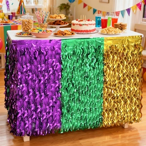 Close-up of green, gold, and purple fringe table skirt for Mardi Gras party decor