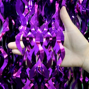Detail of purple metallic foil table fringe with unique scalloped wavy cut design
