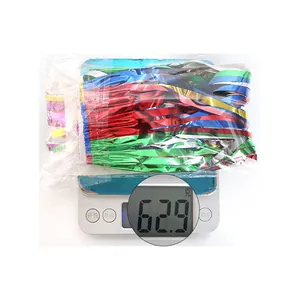 Detailed view of colorful 40cm tinsel fringe skirt weighing 62.9 grams on a digital scale