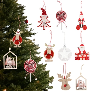 Detail of assorted wooden Christmas ornaments including Santa, reindeer and XMAS signs