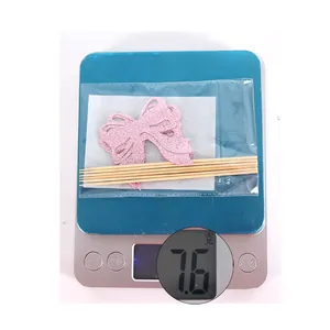 Pink glitter bow cake toppers set with bamboo sticks and glue dots weighing 7.6g